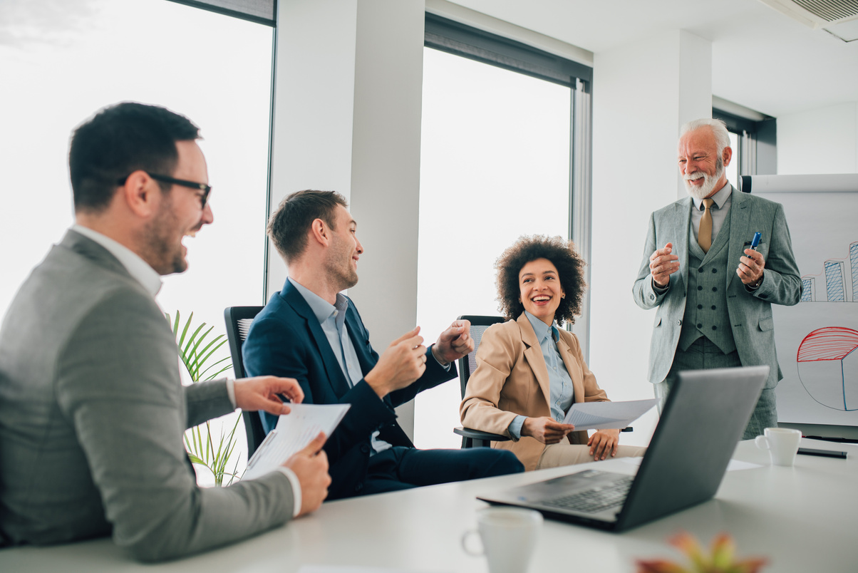 Happy coworkers at business meeting